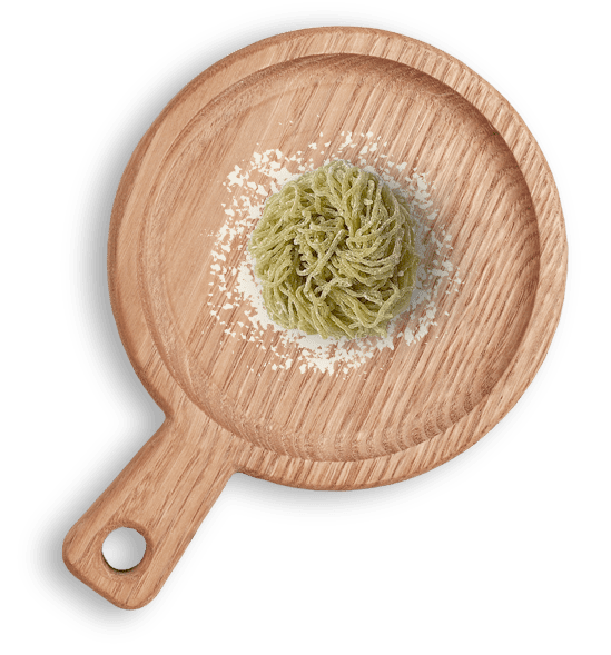 Fresh veggie Egg Noodle (Kale) on a wooden cutting board เส้นพาสต้าไข่สดผสมผักเคลออร์แกนิคบนเขียงไม้